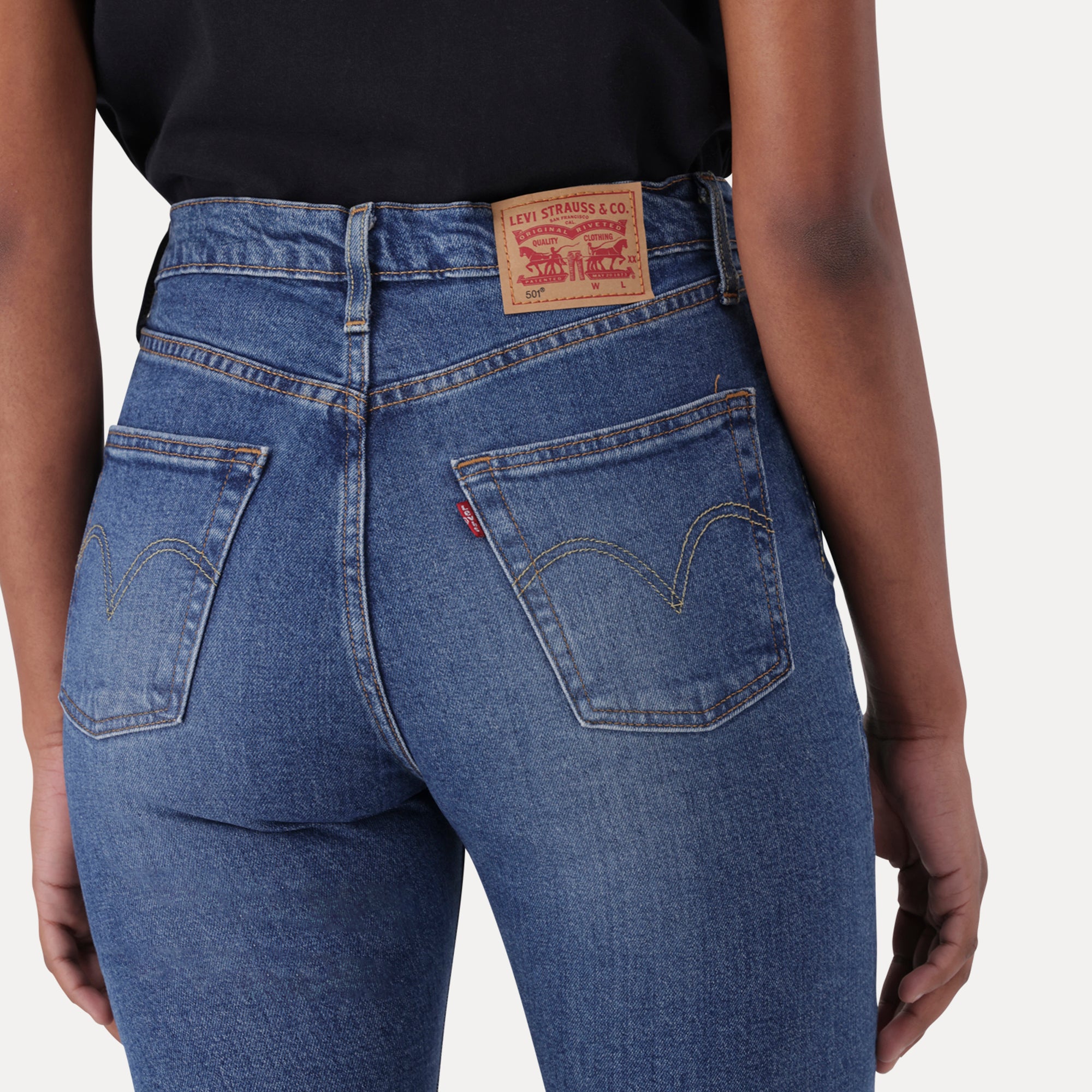 LEVI S WOMEN S 501 ORIGINAL JEANS MED INDIGO WORN IN